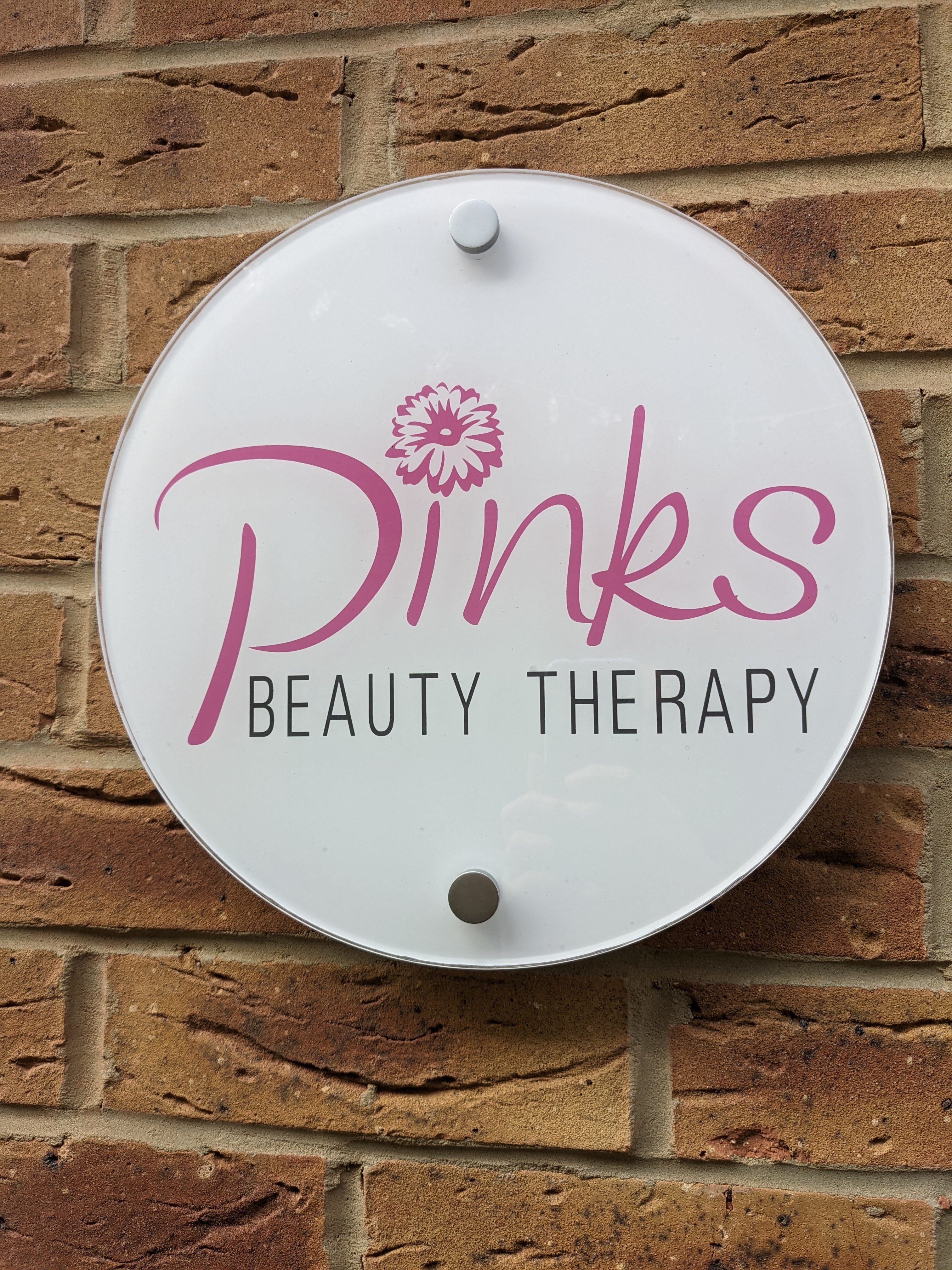 Pinks Beauty Therapy sign at the side entrance