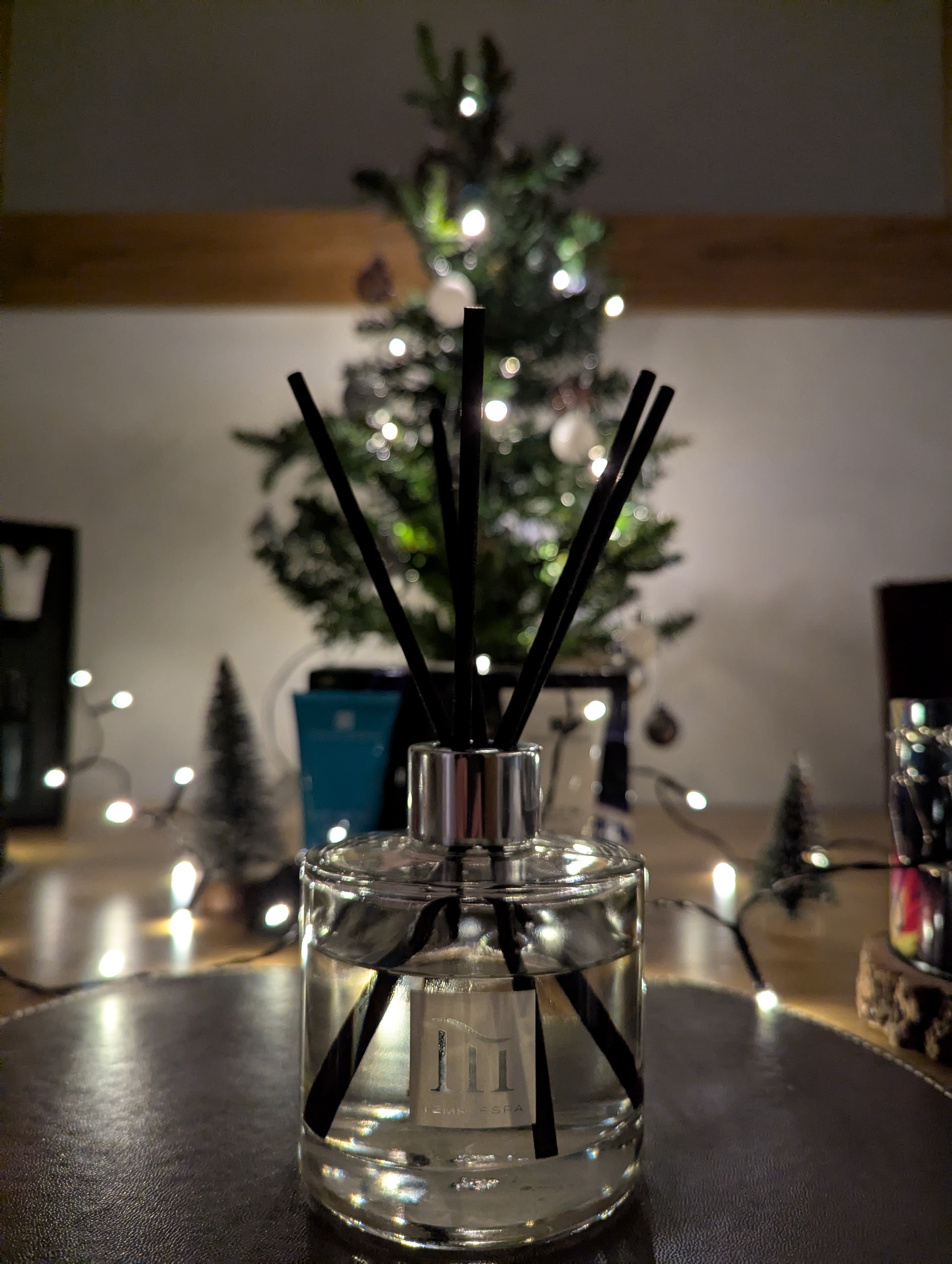 Temple Spa diffuser with Christmas lights and a decorated tree